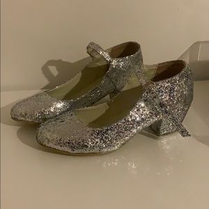 Golden ponies Mary Jane heels.